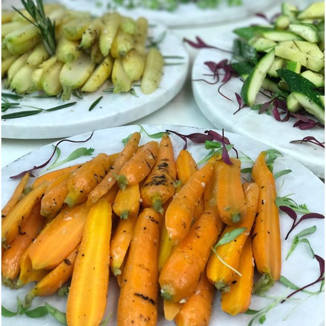 Plate of slightly charred grilled orange carrots